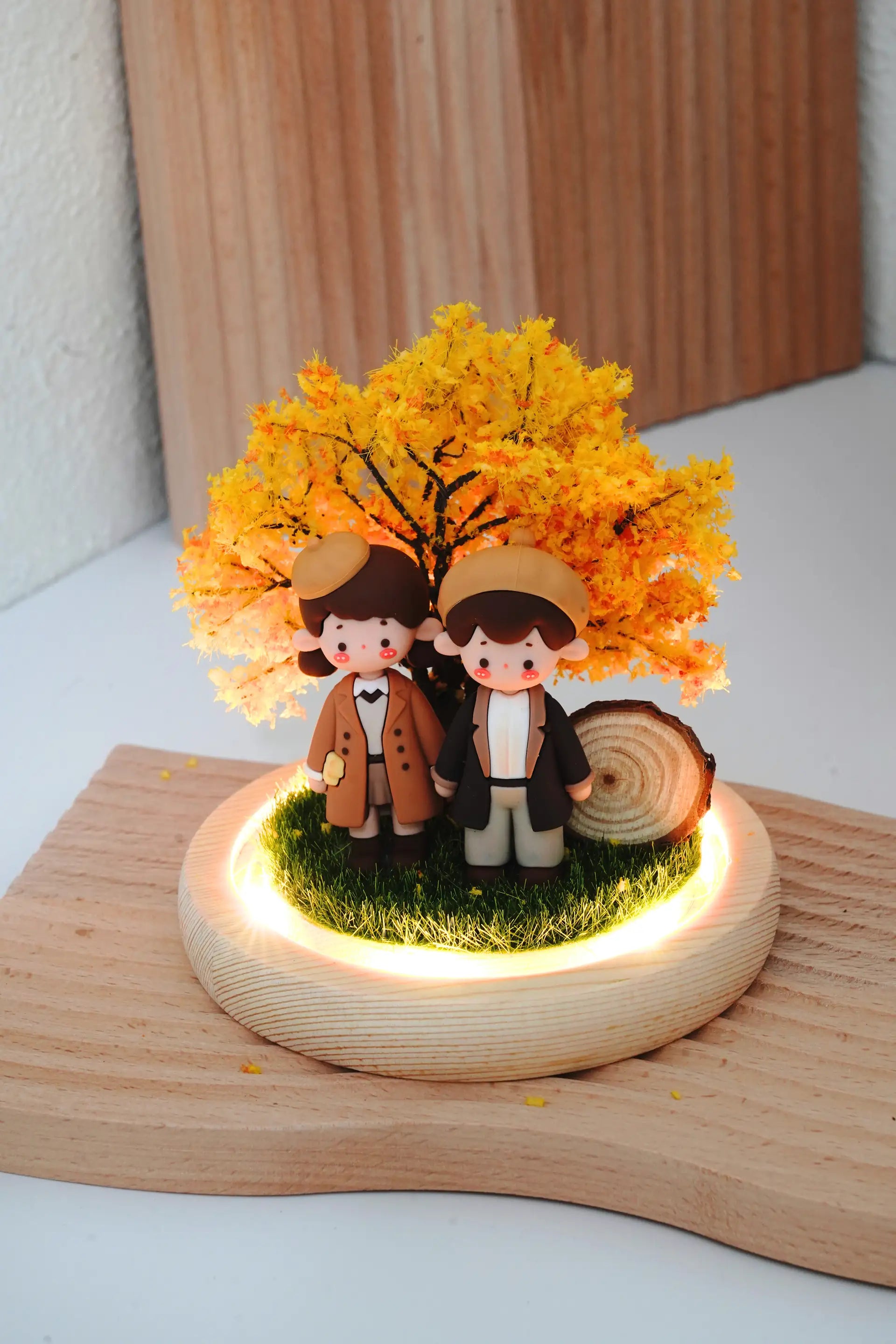 Autumn Love crystal ball interior with couple miniatures illuminated by LED warm lighting, dome removed