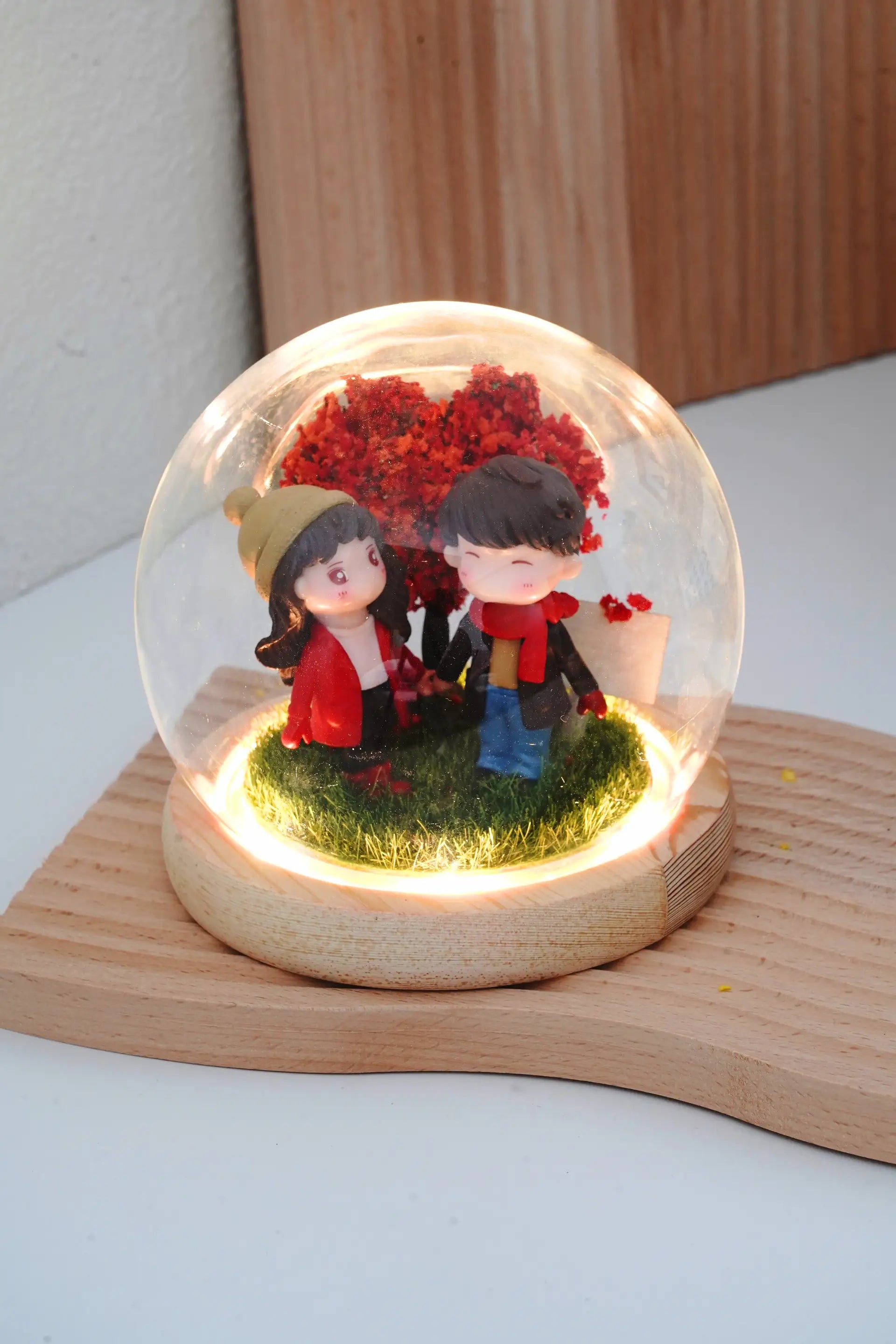 Crimson Love crystal ball with couple miniatures in round glass dome, LED warm lighting on, blank customisable signboard and wooden base