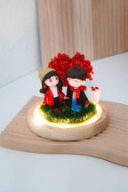 Crimson Love crystal ball interior with couple miniatures and LED warm lighting, round glass dome removed showing blank signboard and wooden base