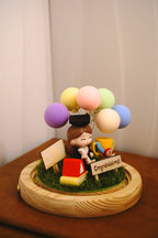Graduation crystal ball with female graduate miniature in round glass dome on wooden base with LED lighting