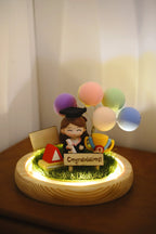 LED illuminated graduation crystal ball with female graduate figure in round glass sphere