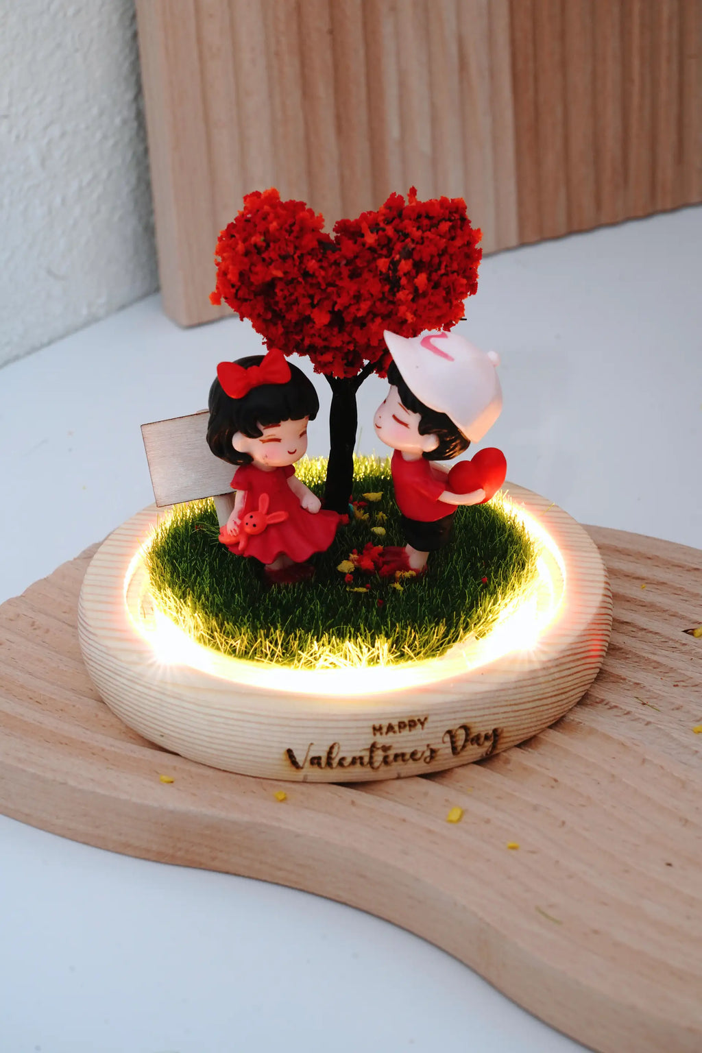 Valentine's crystal ball interior with round glass dome removed, couple miniatures and heart tree visible with LED warm lighting on wooden base